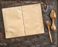 Antique recipe book and wooden kitchen utensils