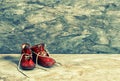 Antique red baby shoes. Vintage Instagram style Royalty Free Stock Photo