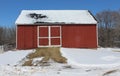 Red Barn Snow with Snow on the Roof and Ground Royalty Free Stock Photo