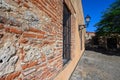 Antique red brick wall, iron grating, wall street lamp. Photo of the surface Royalty Free Stock Photo