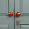 Antique Doors locked on green door. Royalty Free Stock Photo