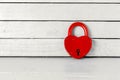 Antique Red Padlock over white wood background Royalty Free Stock Photo