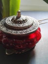 Vintage red jar for storing coins. Feng Shui. Royalty Free Stock Photo