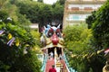 Antique red stairs of Chinese Dragon Tunnel to Ku Ha Mangkorn Sawan or Bua Kli Cave of Wat Ban Tham temple for thai people travel