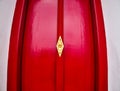 Antique red wood door with gold, ancient Thai architectural art