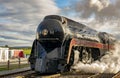 Antique Restored Steam Engine Approaching on Some Old Rail Road Tracks Royalty Free Stock Photo