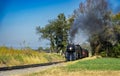 Antique Restored Steam Engine Approaching on Some Old Rail Road Tracks Royalty Free Stock Photo