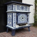 Antique retro oven tiled with blue Dutch tiles,