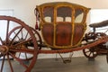 Antique richly decorated wooden red and gold carriage
