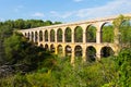 Antique roman aqueduct in forest. Tarragona Royalty Free Stock Photo