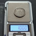 Antique Russian silver coin 50 kopecks 1921 on scales on black background Royalty Free Stock Photo