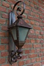 Medieval iron wall lamp on a building