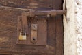 Antique door latch in the Italian countryside. Royalty Free Stock Photo