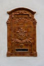 An antique rusty post box.