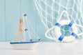 Antique sail boat Toy model with rope and seashell - Nautical ba Royalty Free Stock Photo