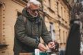 Antique sale of rare goods. Mature man buys vintage items at the flea market