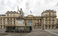 Antique sculpture surrounded by a fence in front of National Assembly building, Paris Royalty Free Stock Photo