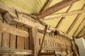 Antique scythe hanging on the wall in the barn.Old farm tools. Royalty Free Stock Photo