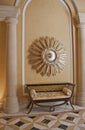 Antique settee and starburst convex mirror