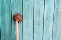 Antique shabby orange handmaded clay pot on a wooden stick on a Royalty Free Stock Photo