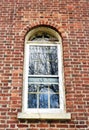 Antique Shaker window in historic brick Watervliet building