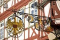 Antique sign with the golden shielded eagle. Royalty Free Stock Photo