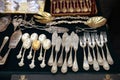 Antique silver Cutlery, spoons, forks, knives on the shelf of the flea market Royalty Free Stock Photo