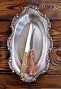 Antique silver cutlery on a wooden table.old knives with wooden handle. Royalty Free Stock Photo