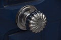 Antique silver doorknob - polished to a shine by years of use mounted on a blue door Royalty Free Stock Photo