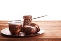 Antique silver pitcher and coffee cup set with dates in a tray i Royalty Free Stock Photo