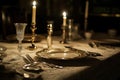 Antique silverware, a delicate lace tablecloth, and the glow of candlelight create a classic and elegant vintage dinner table, Royalty Free Stock Photo
