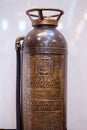 Antique Soda-acid fire extinguisher in a brass container