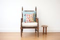 antique spindle chair with embroidered cushion Royalty Free Stock Photo