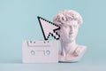 Antique statue is bust of David and pixel mouse pointer and audio cassette