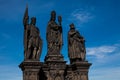 Antique statue of Saints Norbert of Xanten, Wenceslas and Sigismund on the medieval gothic Charles Bridge