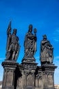 Antique statue of Saints Norbert of Xanten, Wenceslas and Sigismund on the medieval gothic Charles Bridge