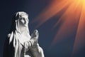 Antique statue of Virgin Mary against blue sky Royalty Free Stock Photo