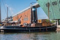 Antique steam boat docked near NEMo science museum, Amsterdam, Netherlands