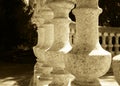 Antique stone baluster in sepia tone. Round structure Royalty Free Stock Photo