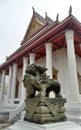 Antique Stone Chinese lion sculpture guarding the royal temple Bangkok Thailand