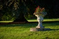 Antique stone park vase with red pelargonium Royalty Free Stock Photo