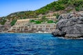 Antique stone wall with many arched holes in the abandoned park Emirgan Ulas Mesire Yeri in Alanya Turkey. Landscape with a