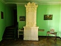 Antique stove tiled with beautiful tiles in the Latvian Bauska Castle in autumn 2020