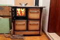 Antique stove a wood-burning Stove with fire lit in the old home