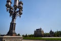 Antique street lamp and blue sky on background. Large street lamp with five lamps Royalty Free Stock Photo