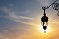 Antique street lamp lantern over sunset sky Royalty Free Stock Photo