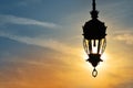 Antique street lamp lantern over sunset sky Royalty Free Stock Photo