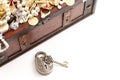 An Antique Style Lock and a Treasure Chest FIlled with Gold and DIamond Treasures Royalty Free Stock Photo