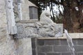 Antique style water tap madeup of natural stone with beautiful architectural design located in the outside of the temple Royalty Free Stock Photo