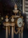 Antique table clock with marble and gold details